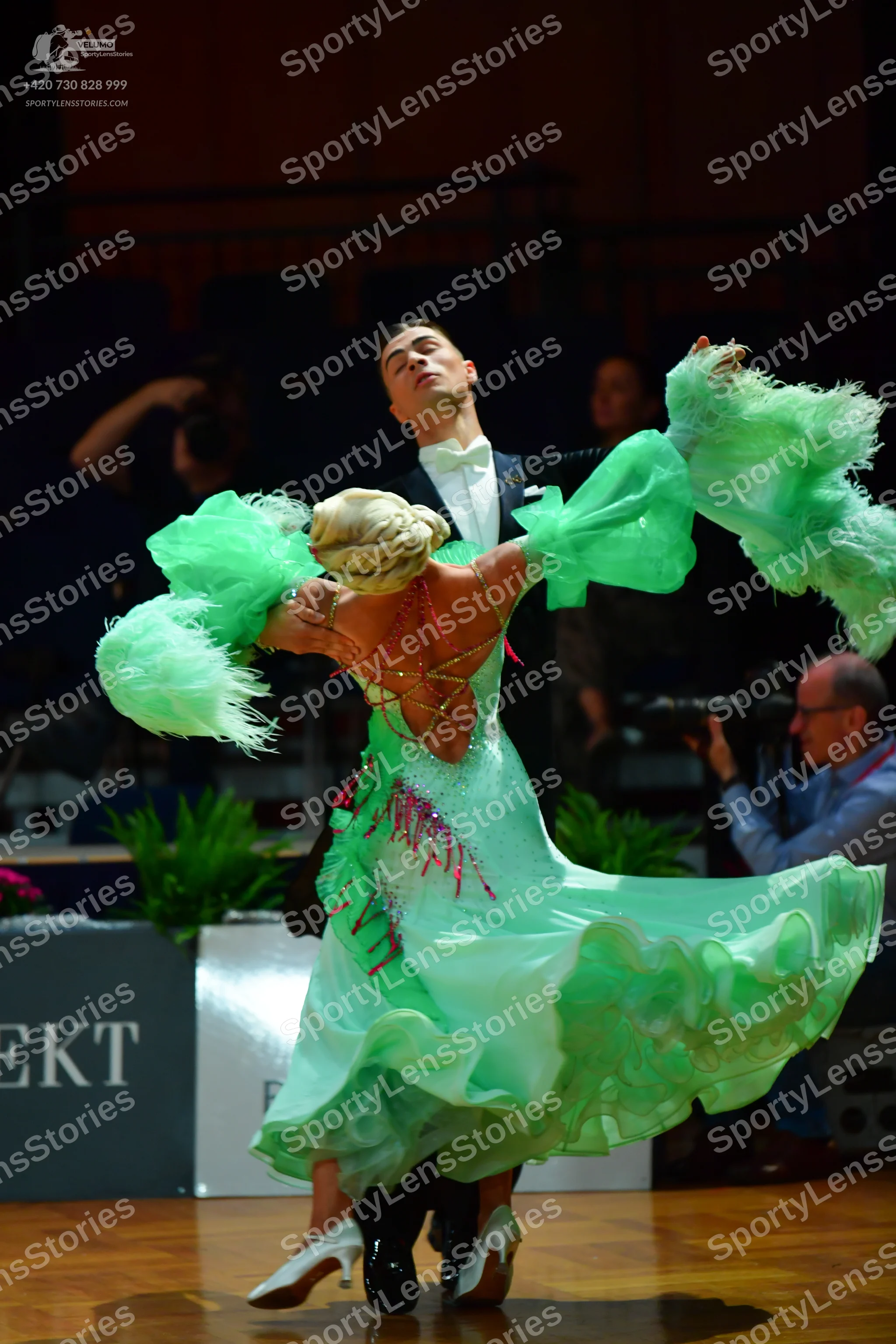 Dancesport competitor: Male dancer: black tuxedo with a white shirt and white bowtie