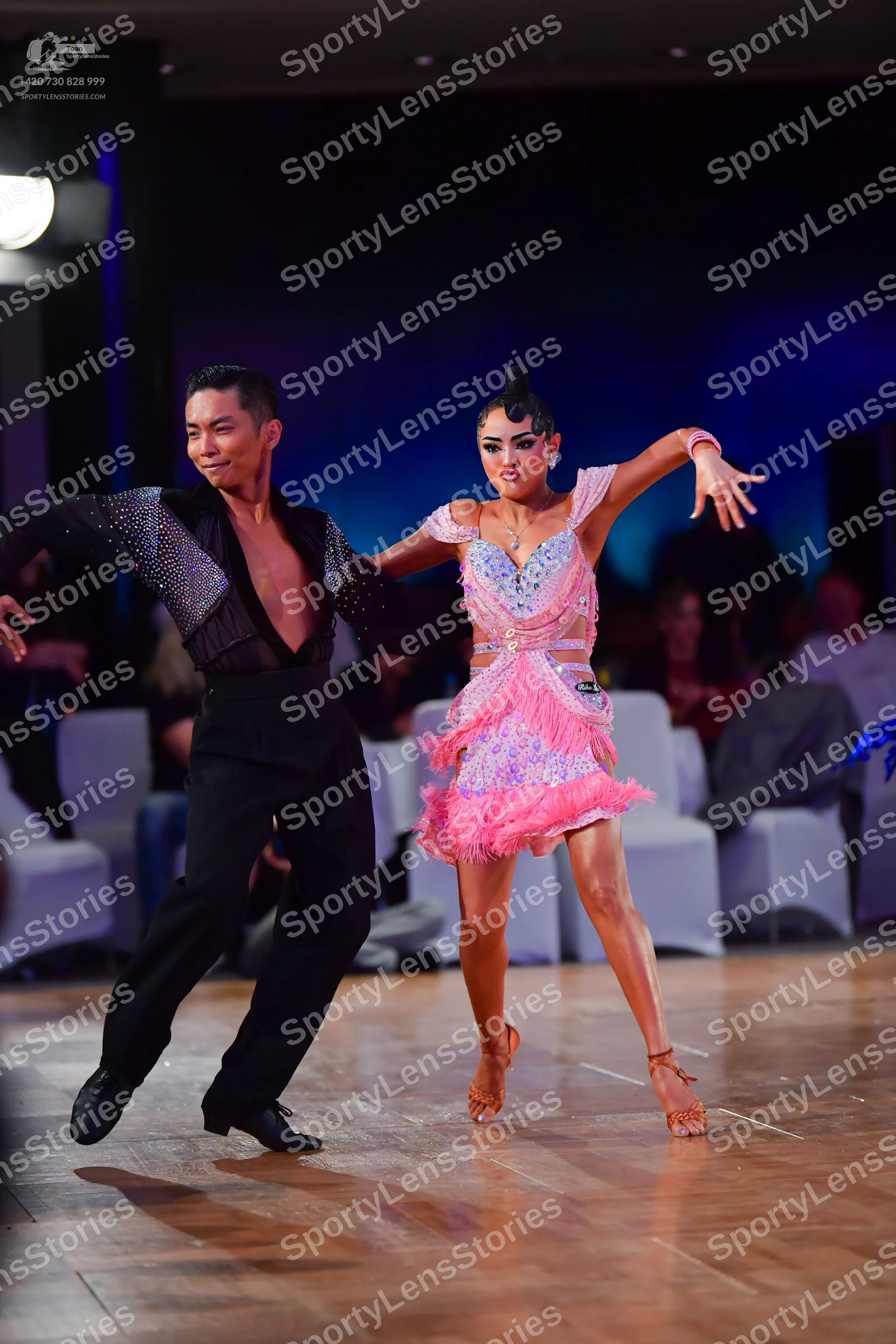 Dancesport competitor: Male dancer: black long-sleeved shirt with sequin embellishments on the chest an