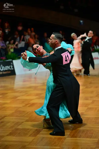 Dancesport competitor #41: Male dancer: black suit, white shirt, and black bow tie