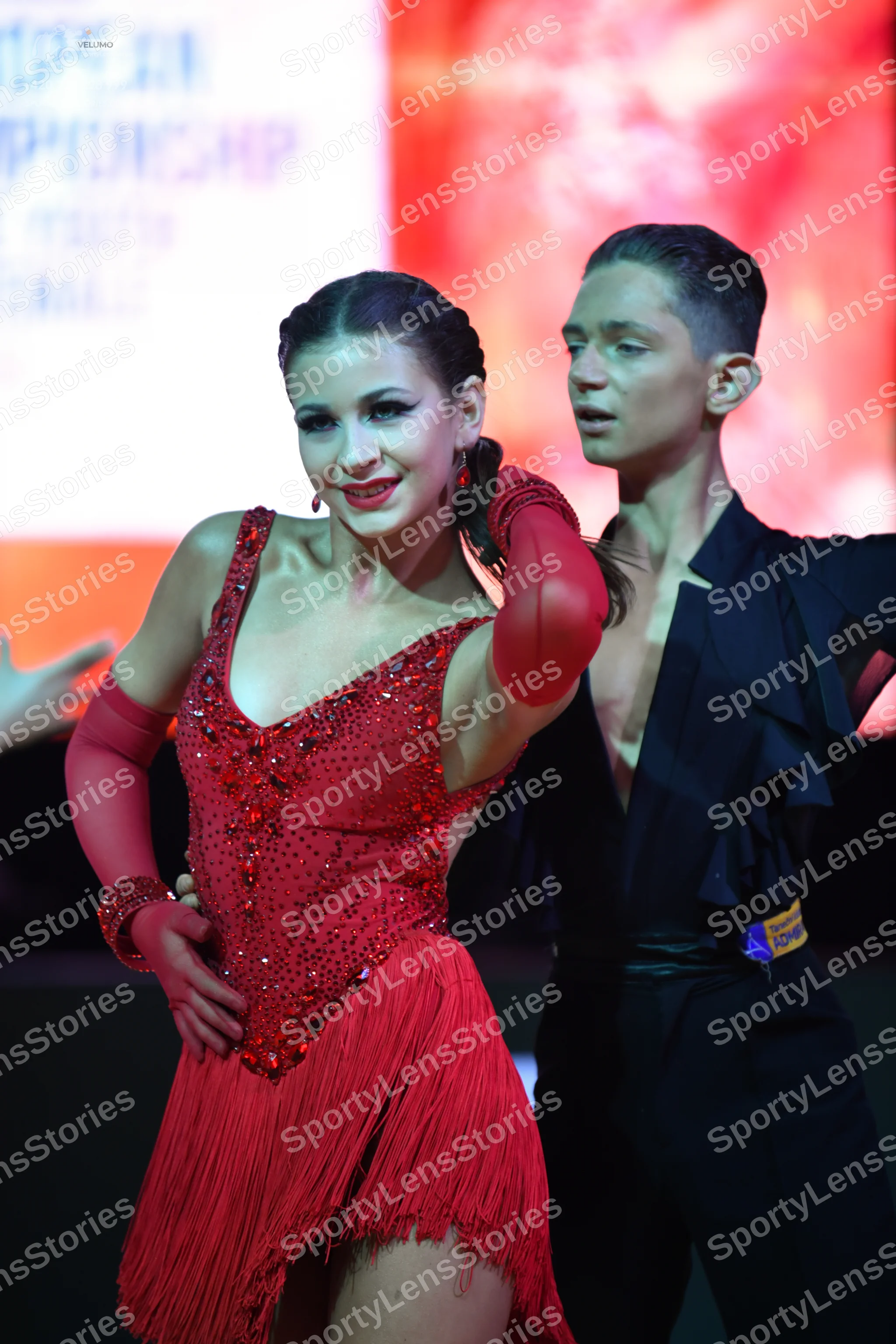 Dancesport competitor: Male dancer: black Latin dance shirt with ruffled layers and black trousers