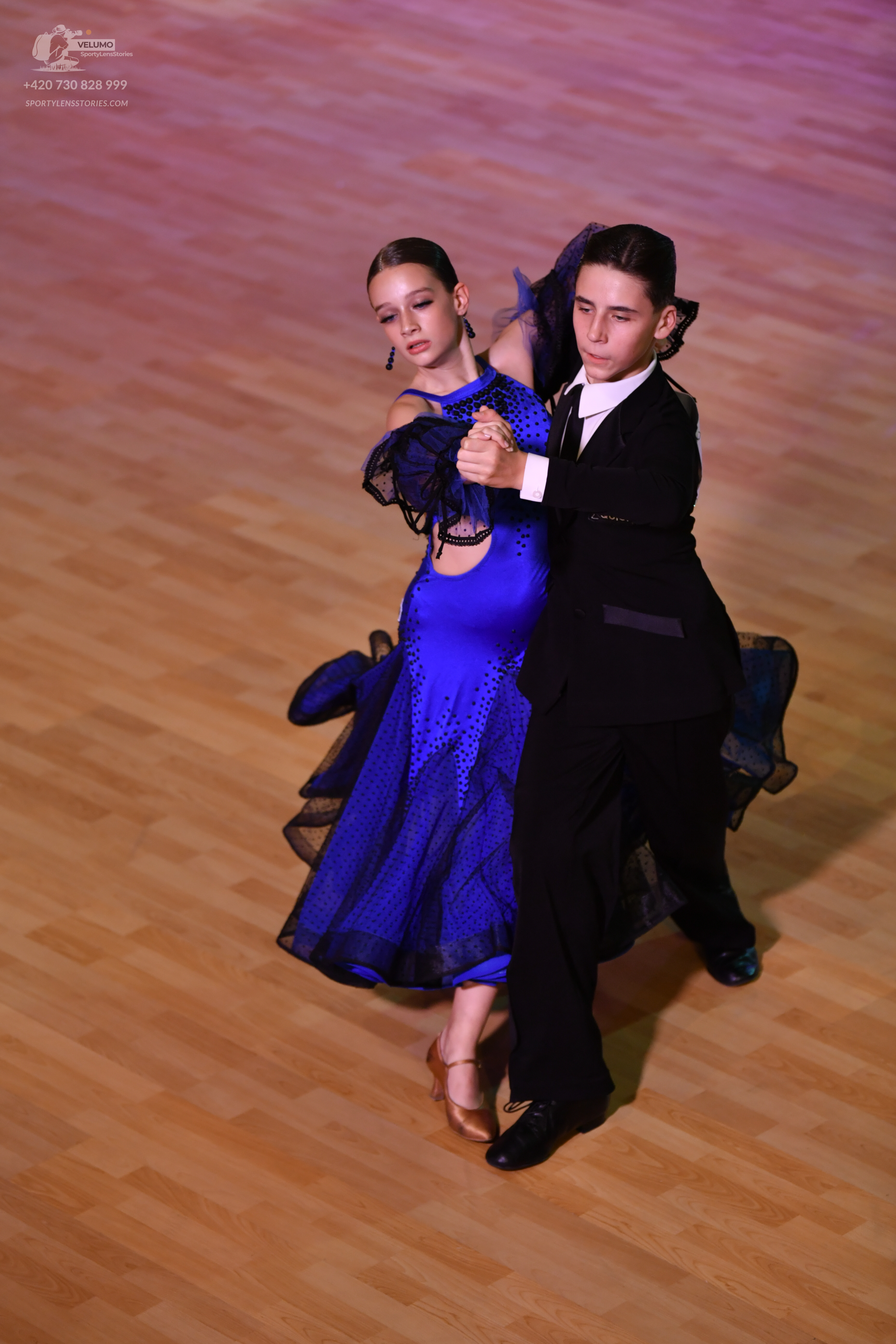 Dancesport competitor: ** Male: Black suit with a sequin lapel