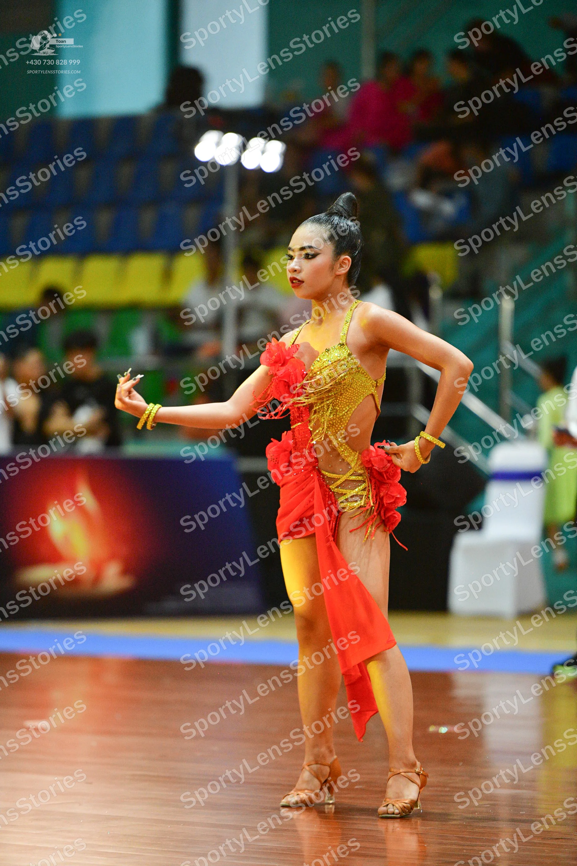 Dancesport competitor: ** Red Latin Dress
*   **Color:** Predominantly vibrant red