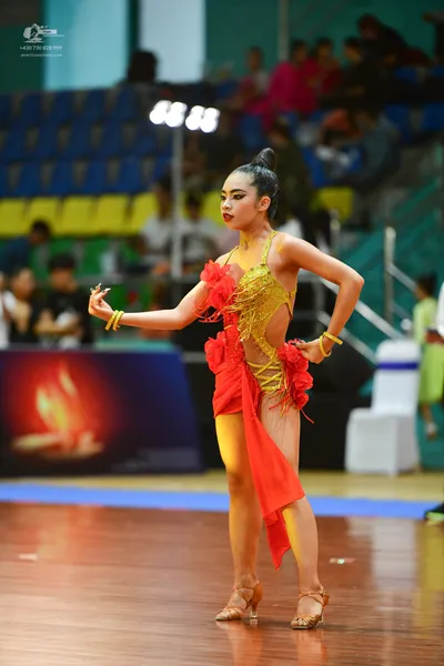 Dancesport competitor: ** Red Latin Dress
*   **Color:** Predominantly vibrant red