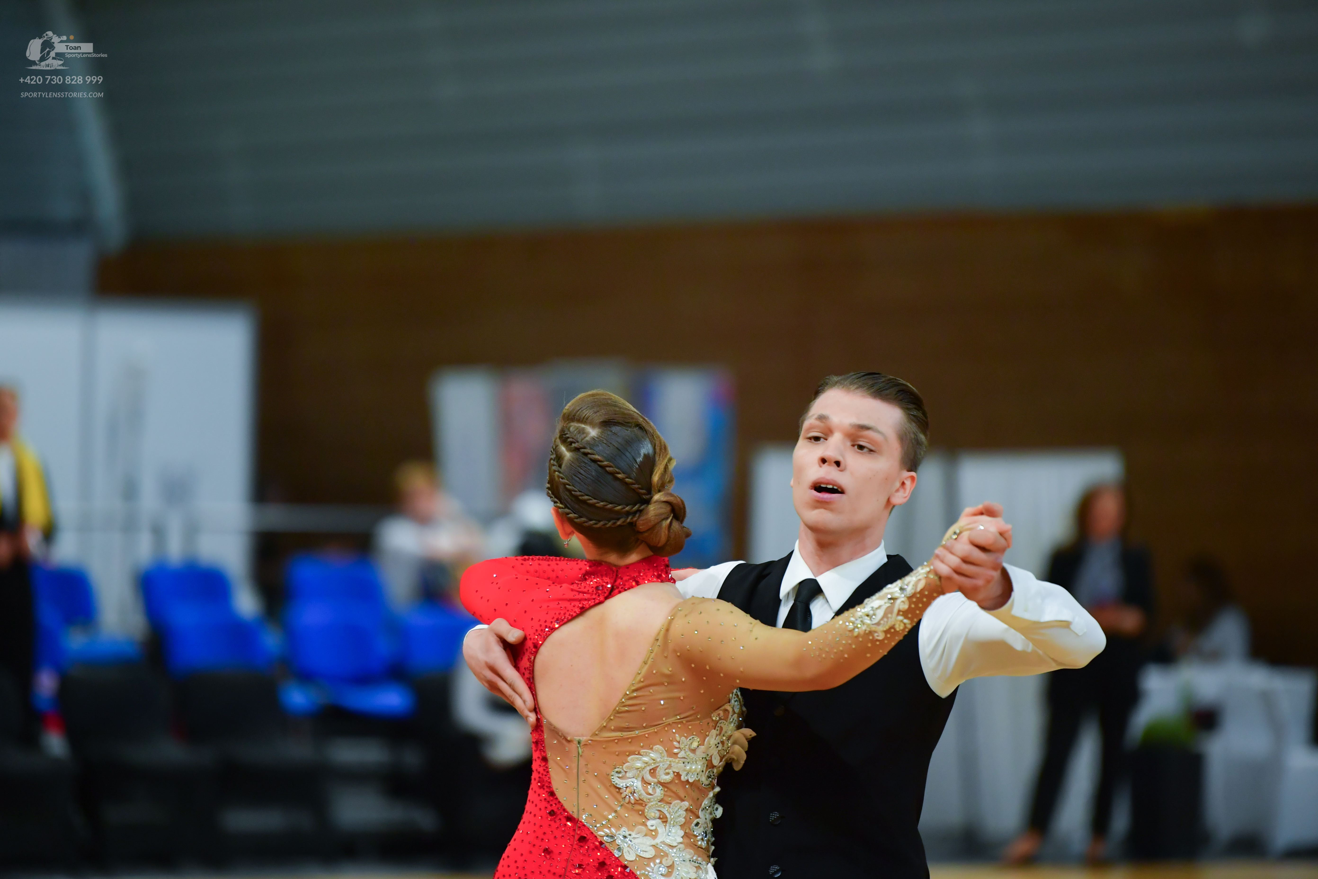Dancesport competitor: Female dancer: red latin dress with beige lace and sequin details