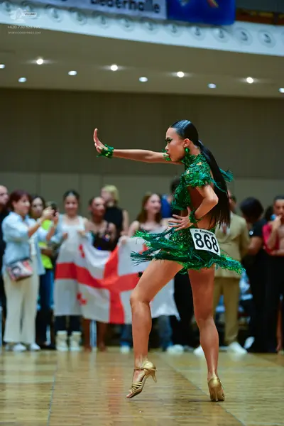 Dancesport competitor #868: Female dancer: green latin dress with fringe