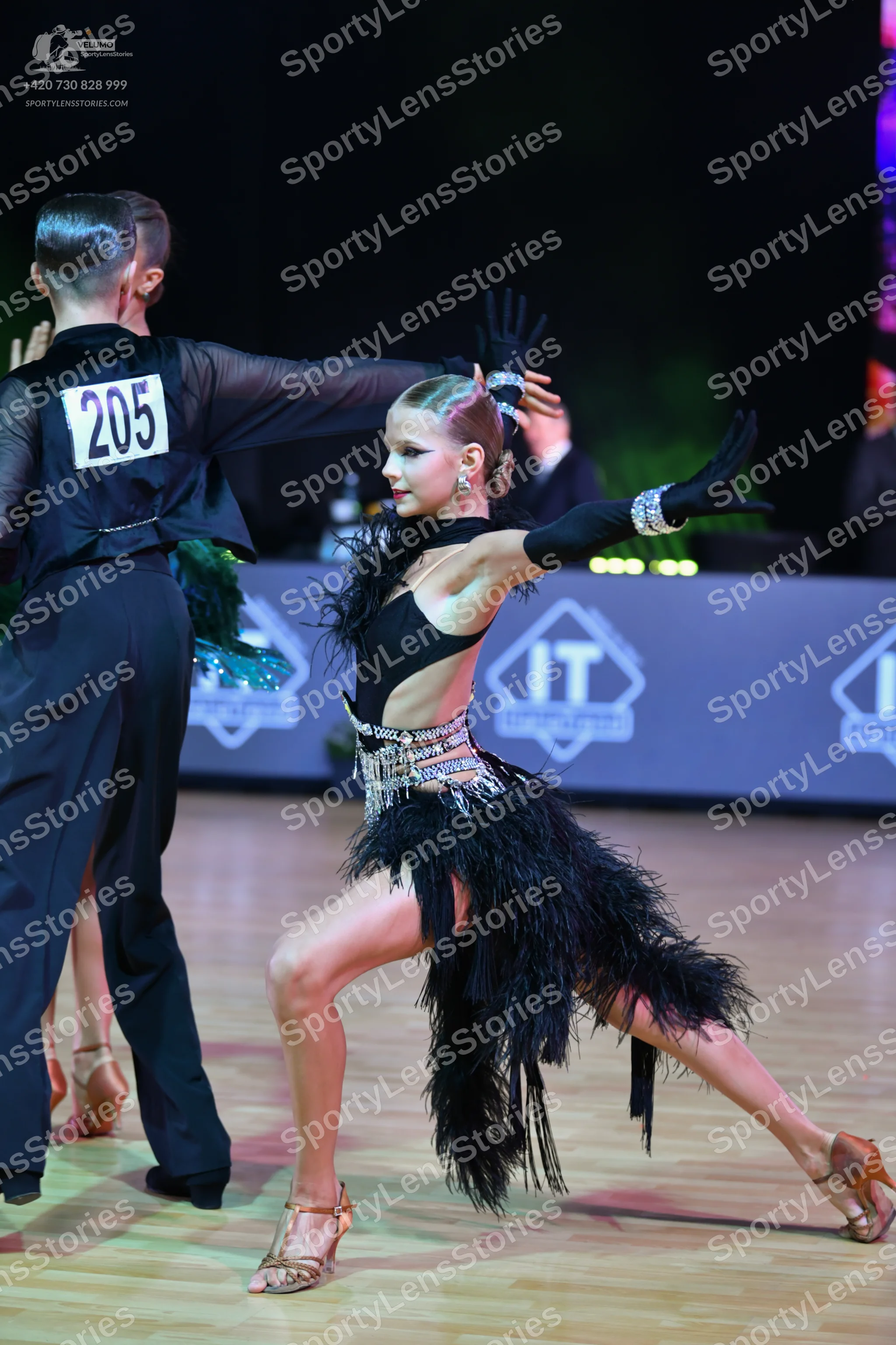 Dancesport competitor: Male dancer: black long-sleeved shirt and black trousers