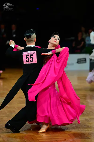 Dancesport competitor #55: Male dancer: black tailcoat suit with a white shirt collar