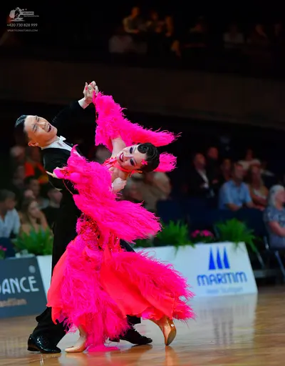 Dancesport competitor: Male dancer: black long-sleeved shirt and black trousers