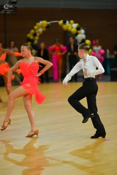 Dancesport competitor: ** Black tail suit