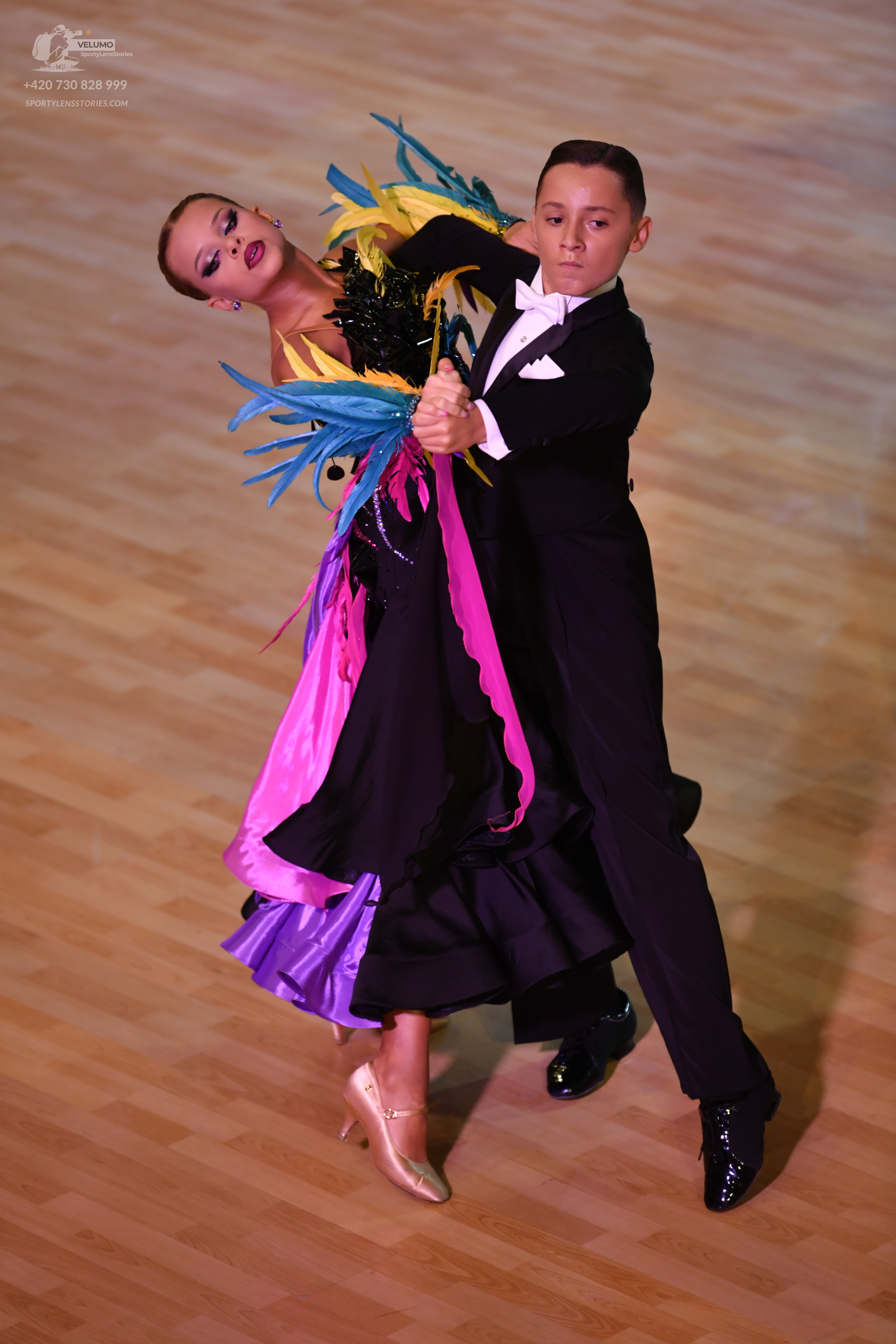 Dancesport competitor: ** Red Latin dress
*   **Color:** Primarily a vibrant red