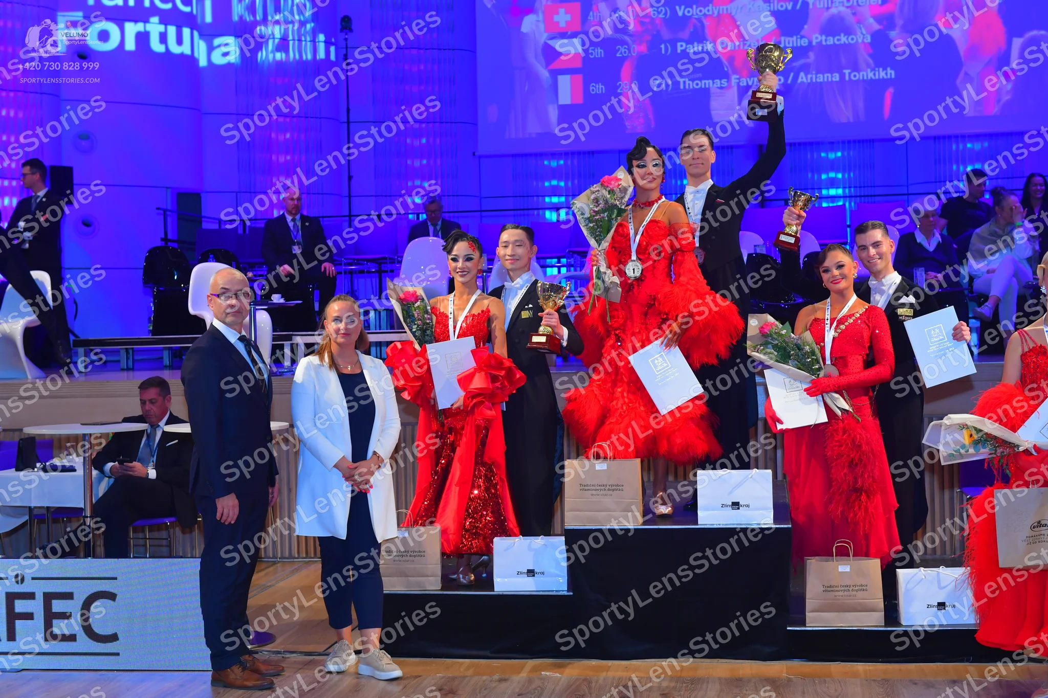 Dancesport competitor: Male dancers: black suits, white shirts, and black ties