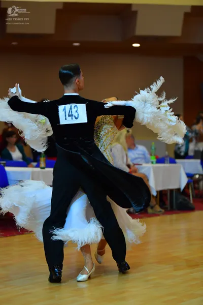 Dancesport competitor #143: Male dancer: black suit with black trousers and black dance shoes