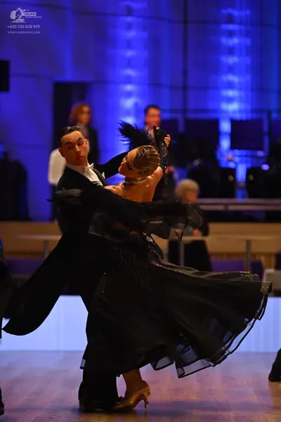 Dancesport competitor: Male dancer: black tuxedo