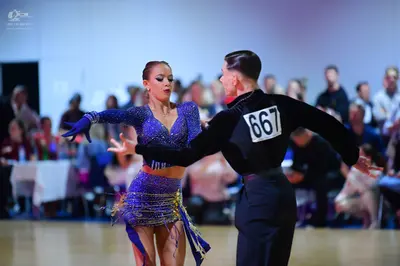 Dancesport competitor #667: Male dancer: black long-sleeved top and black trousers