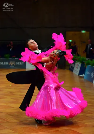Dancesport competitor: Male dancer: black suit with white shirt and black bowtie