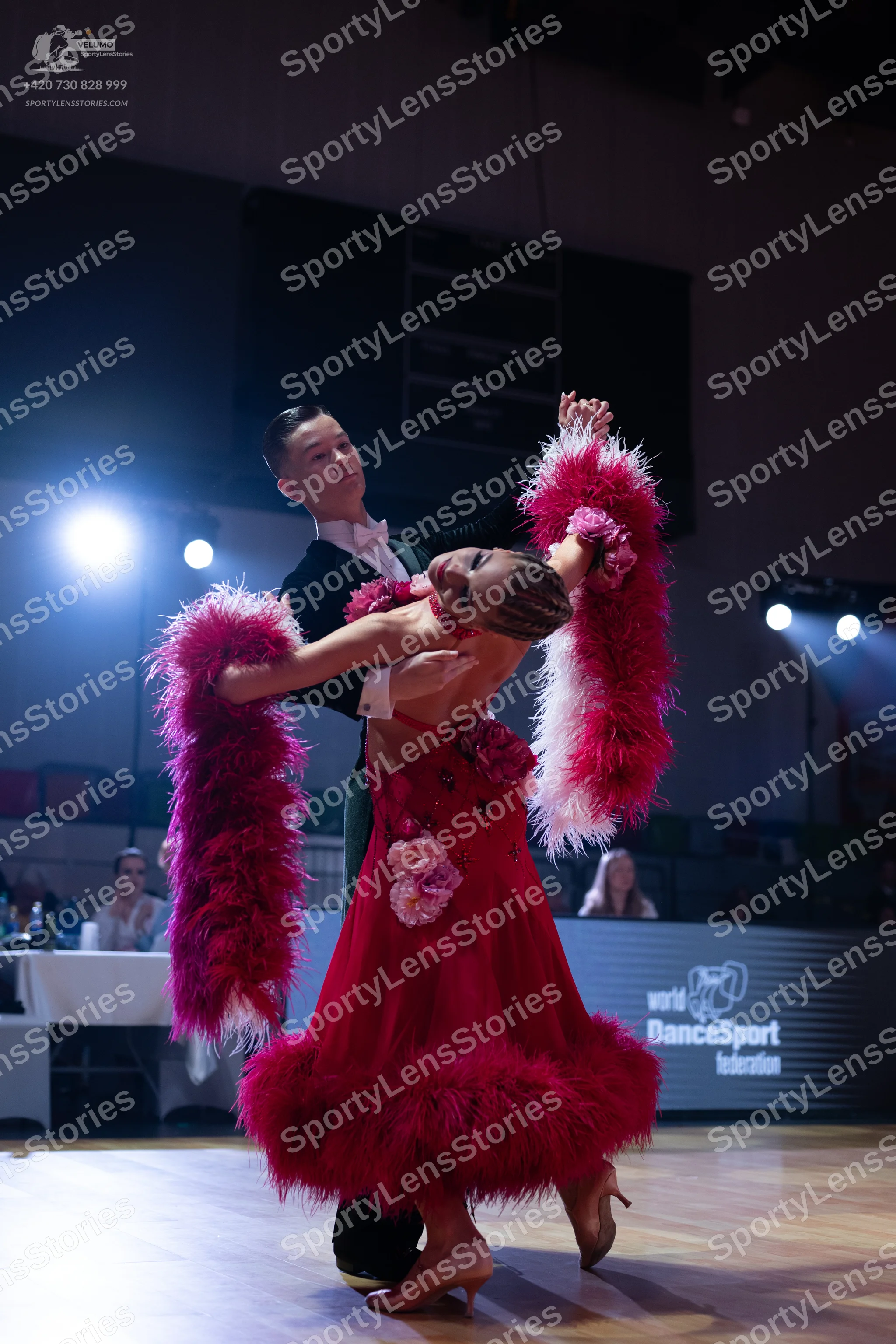 Dancesport competitor: Male dancer: black suit with a white shirt