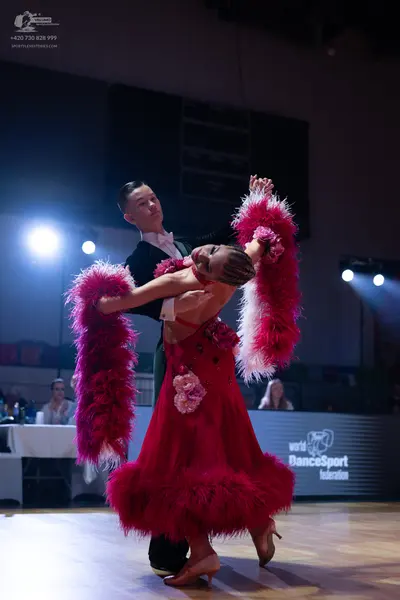 Dancesport competitor: Male dancer: black suit with a white shirt