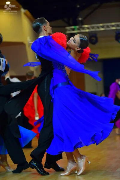 Dancesport competitor: Male dancer: black ballroom tailcoat, black trousers, and black dance shoes