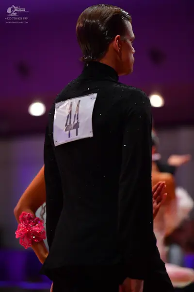 Dancesport competitor: Male dancer: black suit