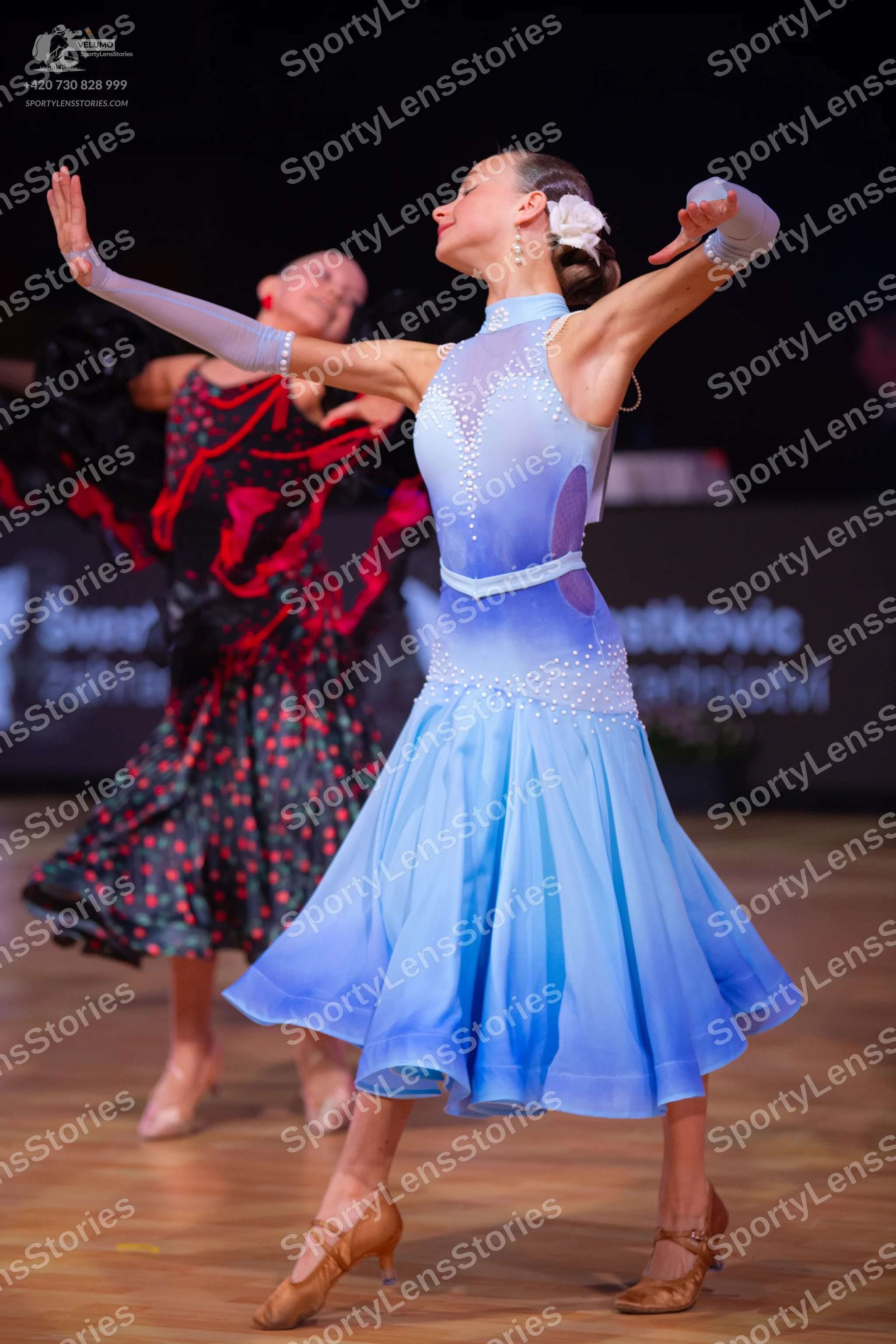 Dancesport competitor: Female dancer 1: light blue halter-neck Latin dress with rhinestone embellishmen
