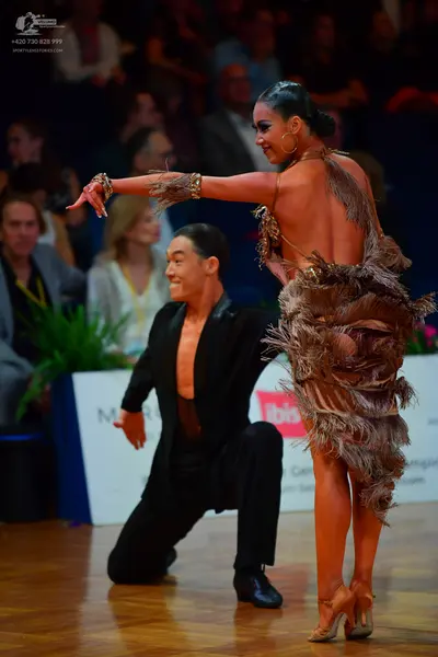 Dancesport competitor: Male dancer: black dance jacket and black trousers
