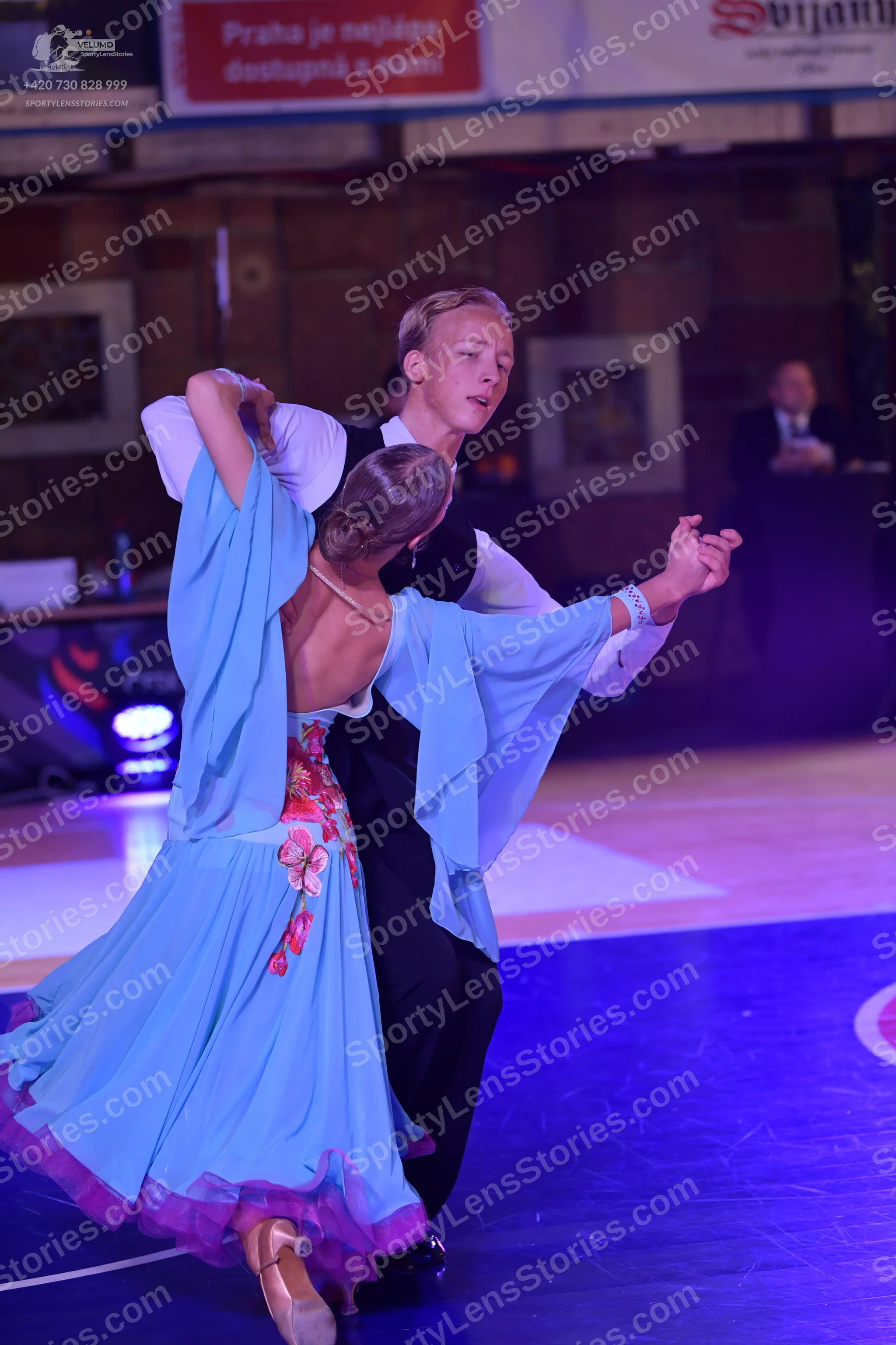 Dancesport competitor: Male dancer: white long-sleeved shirt, black waistcoat, and black trousers