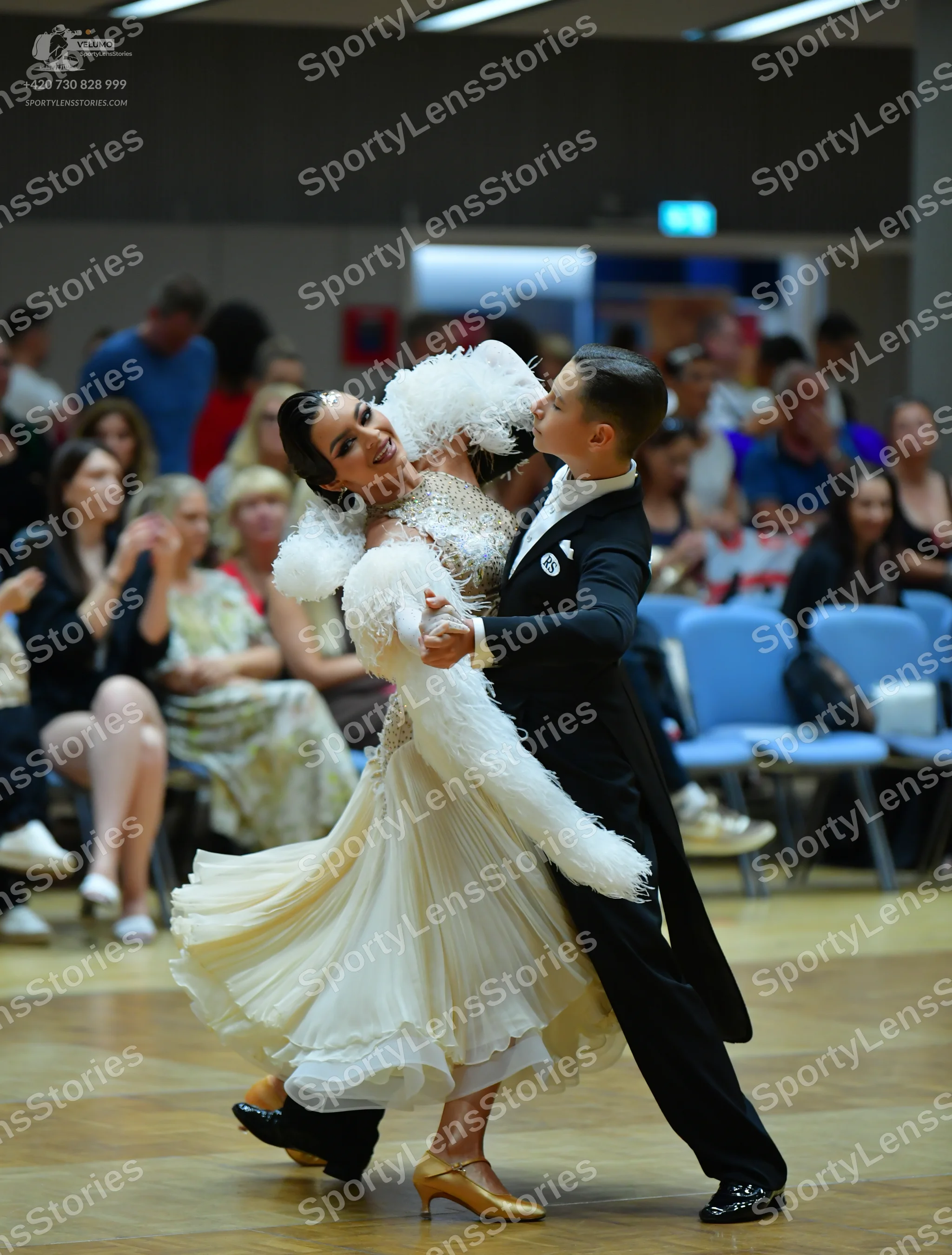 Dancesport competitor: Male dancer: black suit, white shirt, black bow tie, and black shoes