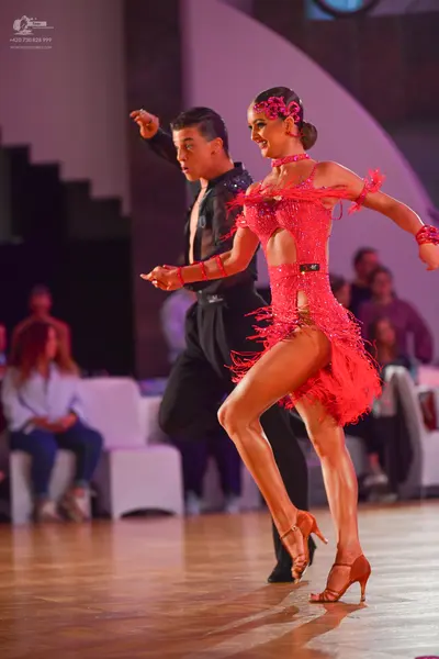 Dancesport competitor: Male dancer: black Latin dance shirt and trousers