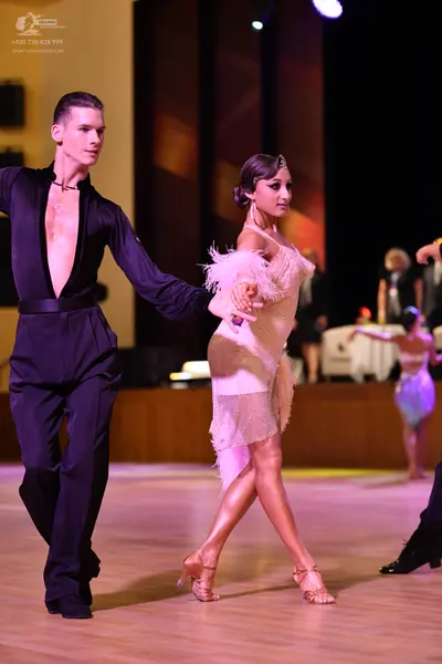 Dancesport competitor: ** 

**Male Dancer:**  Black tailsuit with a sequin lapel