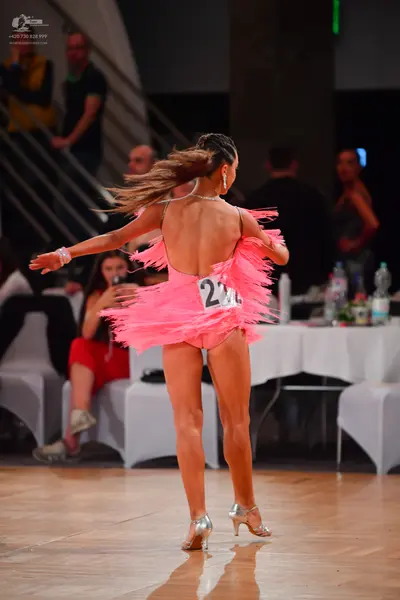 Dancesport competitor #232: Female dancer: pink latin dress with fringe