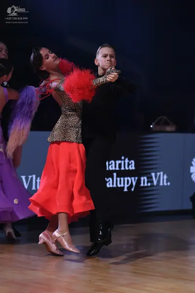 Dancesport competitor: Male dancer: black suit, black shirt, and black dance shoes