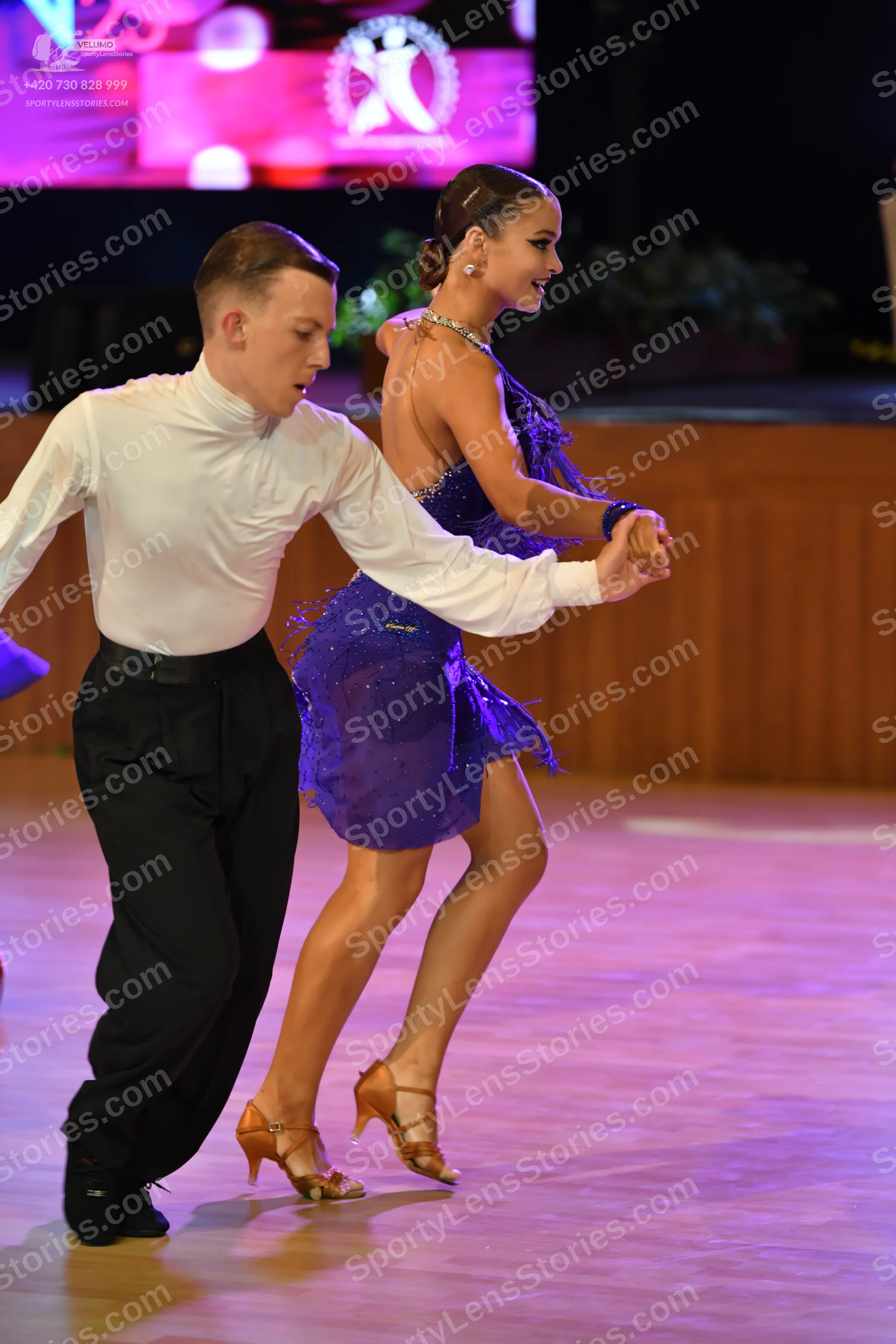 Dancesport competitor: ** Male: black suit with white sequin lapels