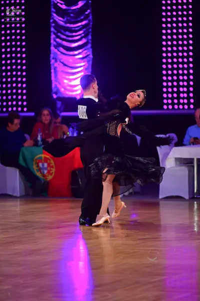 Dancesport competitor #106: Male dancer: black suit and black trousers