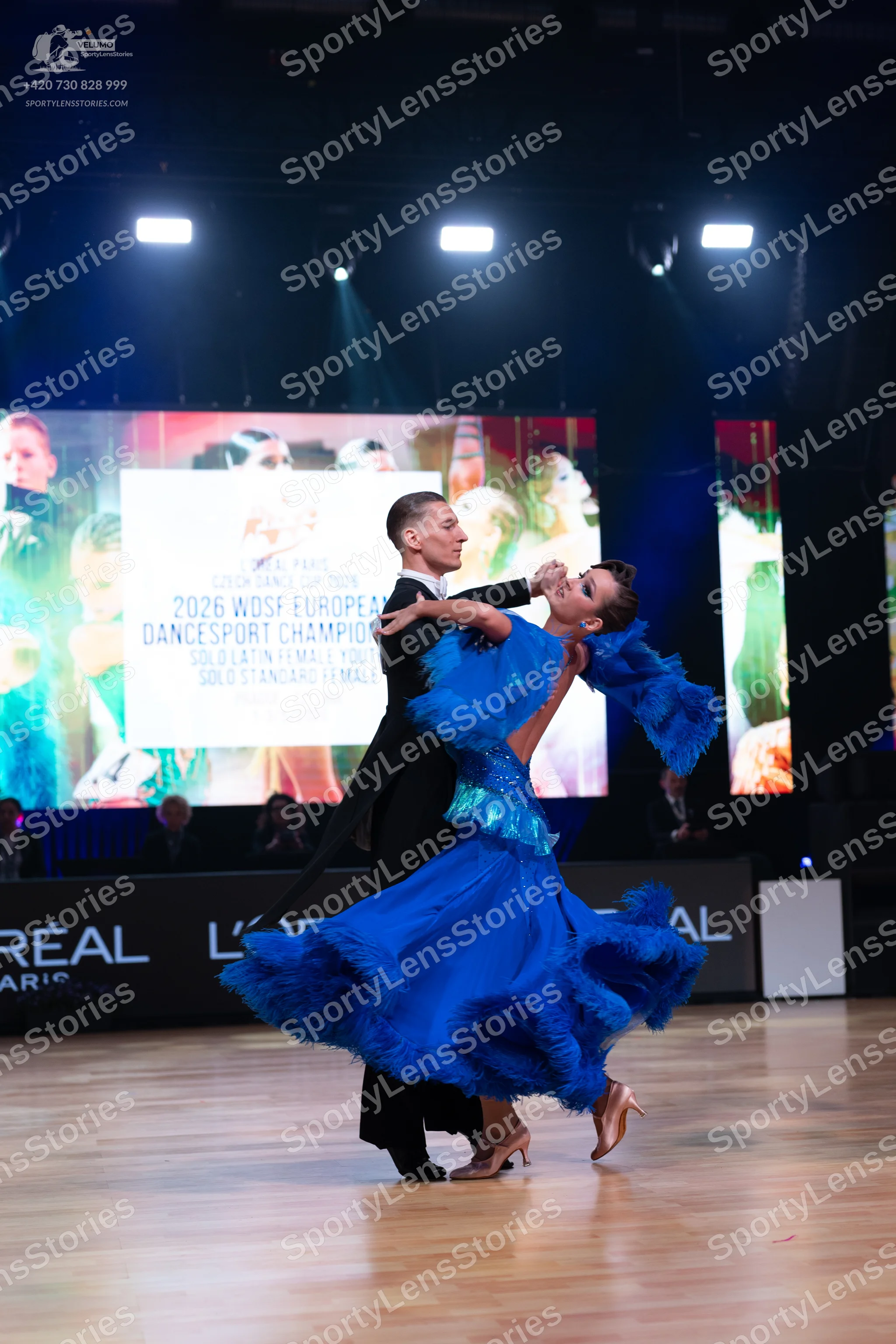 Dancesport competitor: Male dancer: black suit with a white shirt and black bowtie