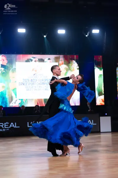 Dancesport competitor: Male dancer: black suit with a white shirt and black bowtie