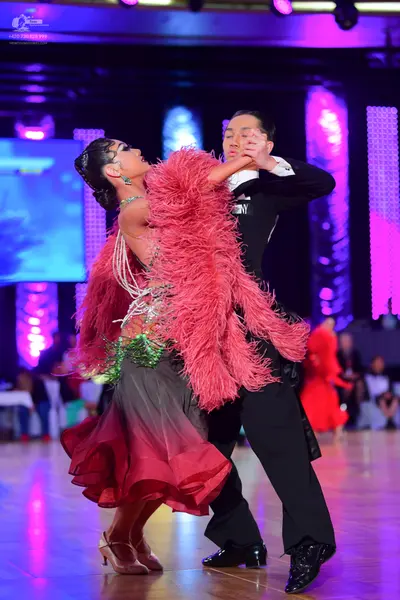 Dancesport competitor: Male dancer: black suit