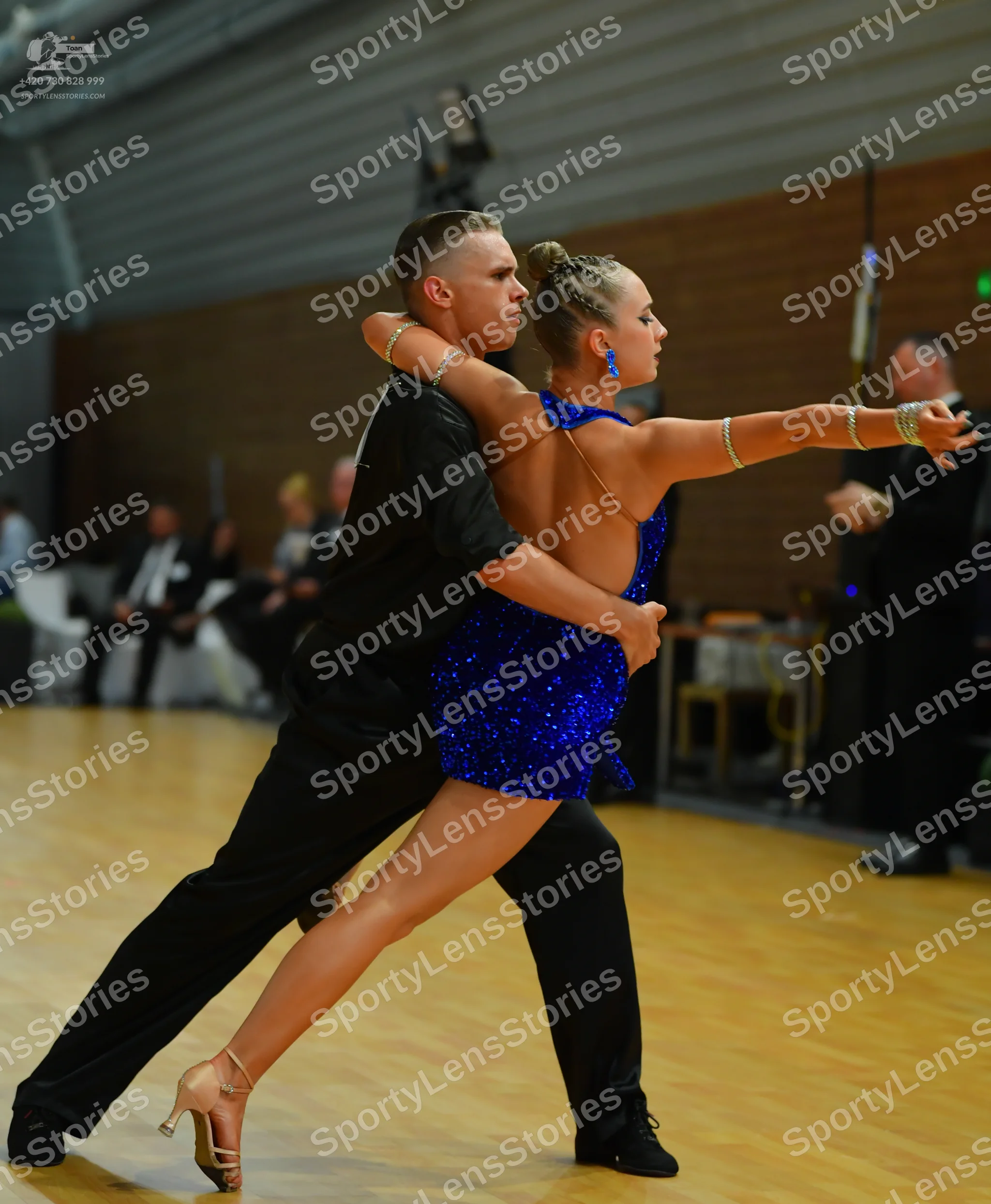 Dancesport competitor: ** Black tailsuit
*   **Fabric:** Primarily sequins with a sheen