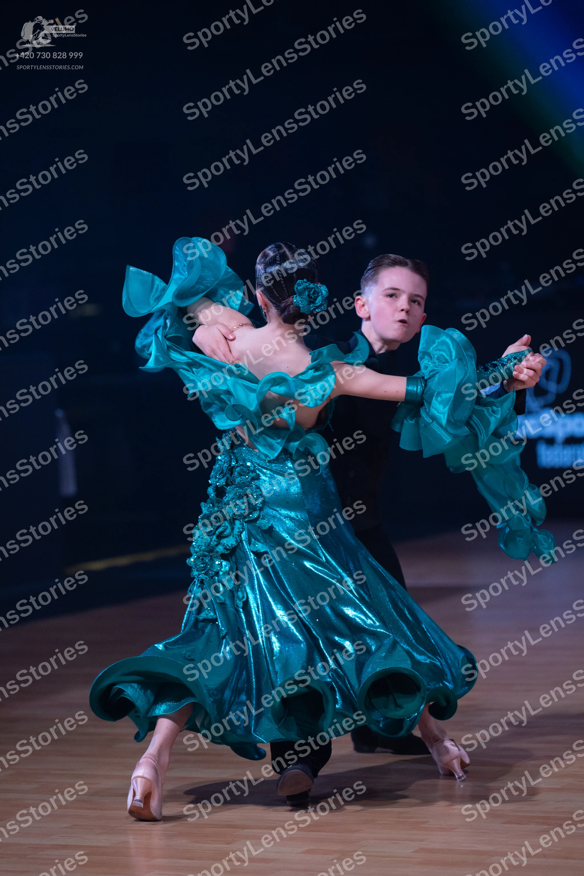 Dancesport competitor: Male dancer: black long-sleeved top and trousers