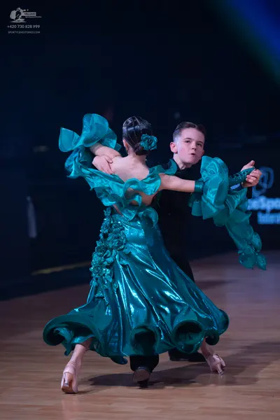 Dancesport competitor: Male dancer: black long-sleeved top and trousers
