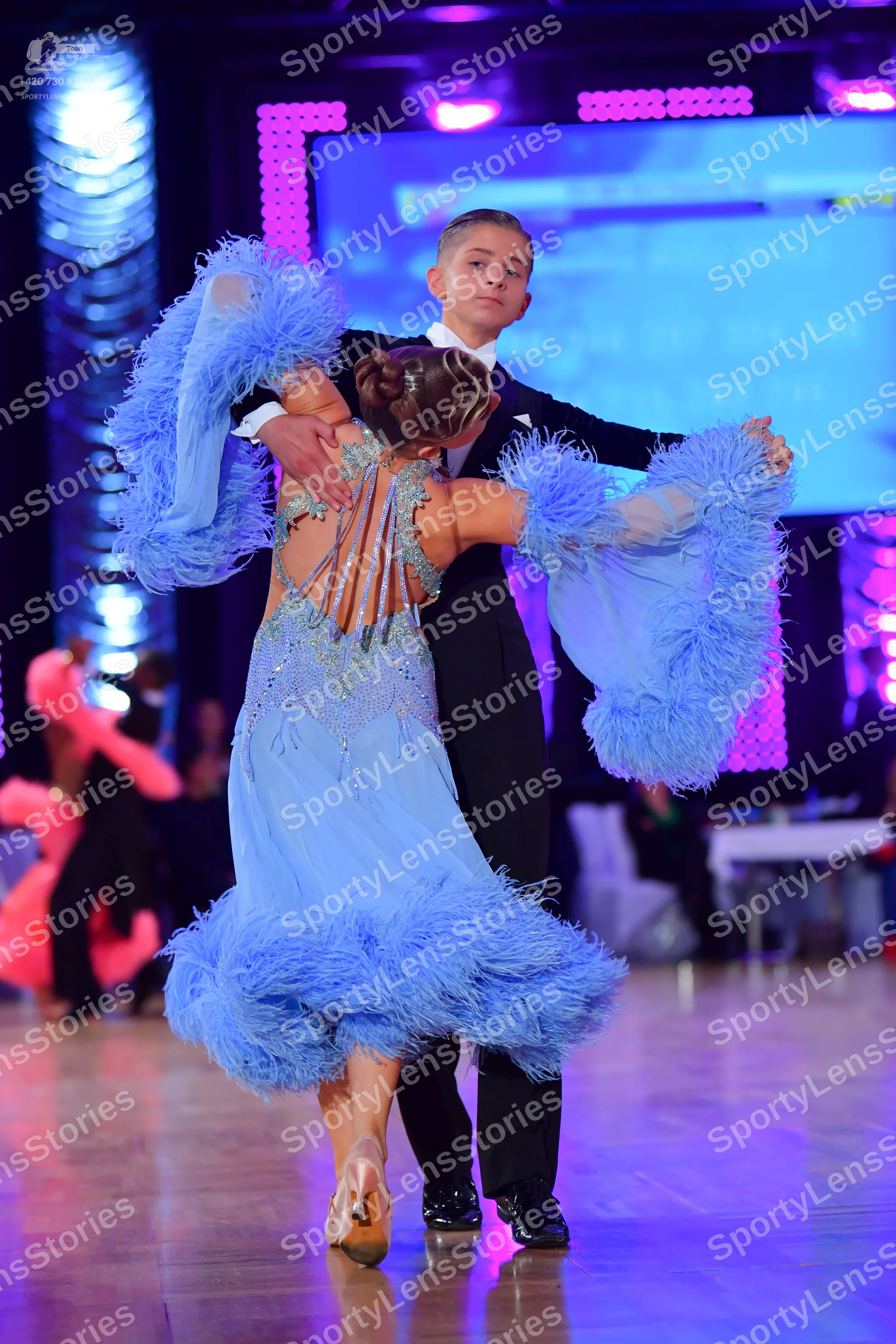 Dancesport competitor: Male dancer: black suit with a white shirt and black trousers