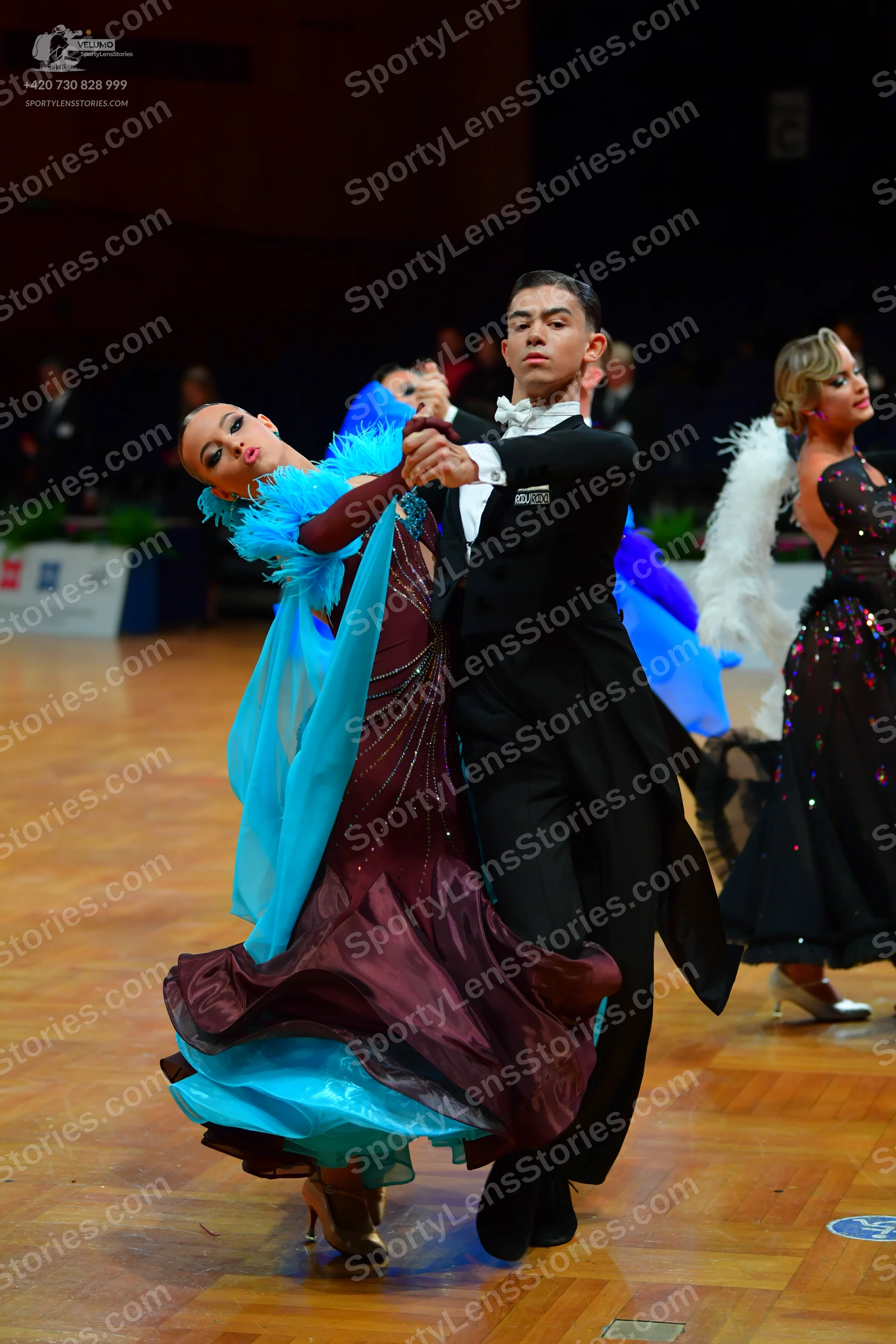 Dancesport competitor: Male dancer: black ballroom tailcoat, white shirt, and white bowtie