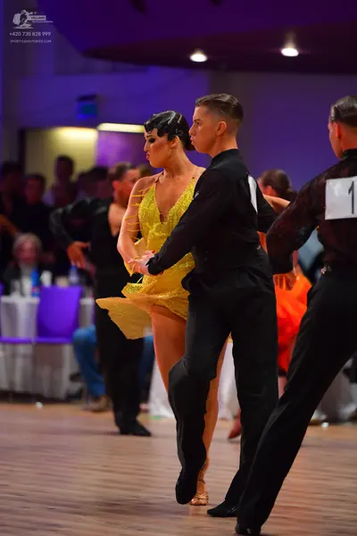 Dancesport competitor: Male dancers: black long-sleeved shirts and black trousers