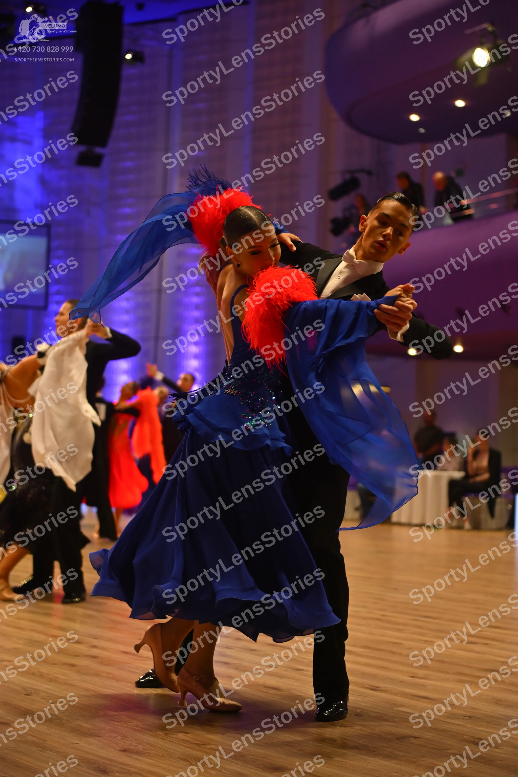 Dancesport competitor: Male dancer: black suit with a white shirt and black bow tie