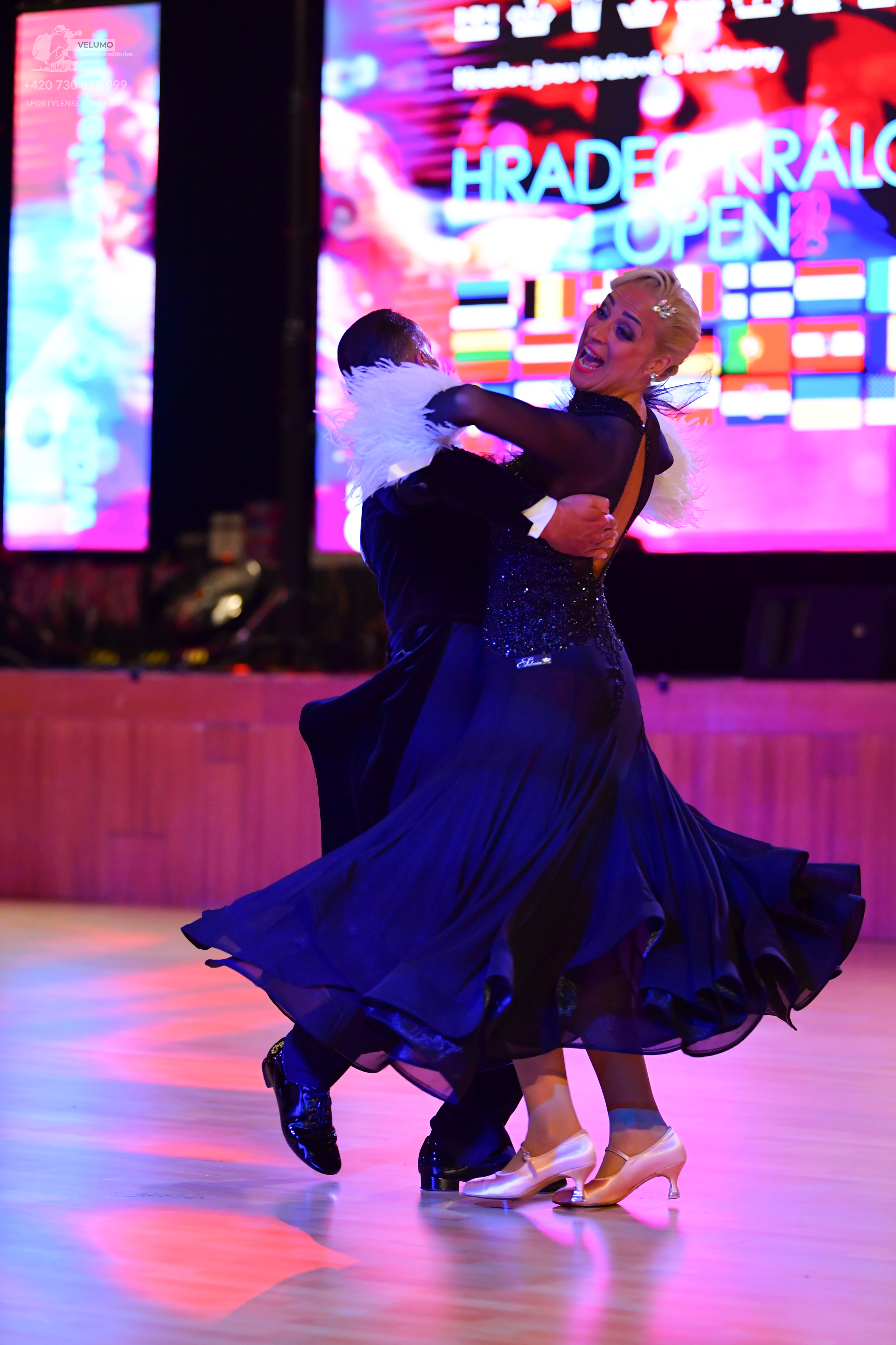 Dancesport competitor: ** Black ballroom suit