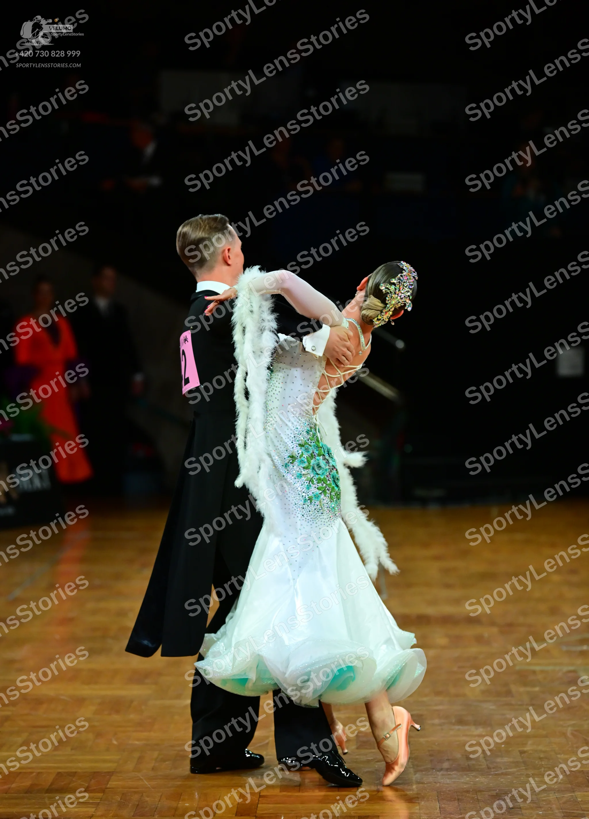 Dancesport competitor: Male dancer: black tailcoat, white shirt, black bow tie, and black trousers