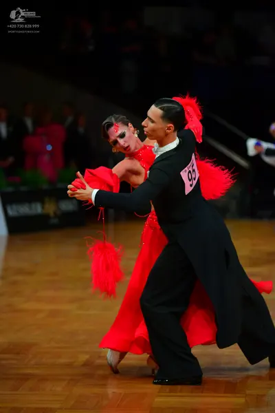 Dancesport competitor: Male dancer: black tailcoat with a white shirt