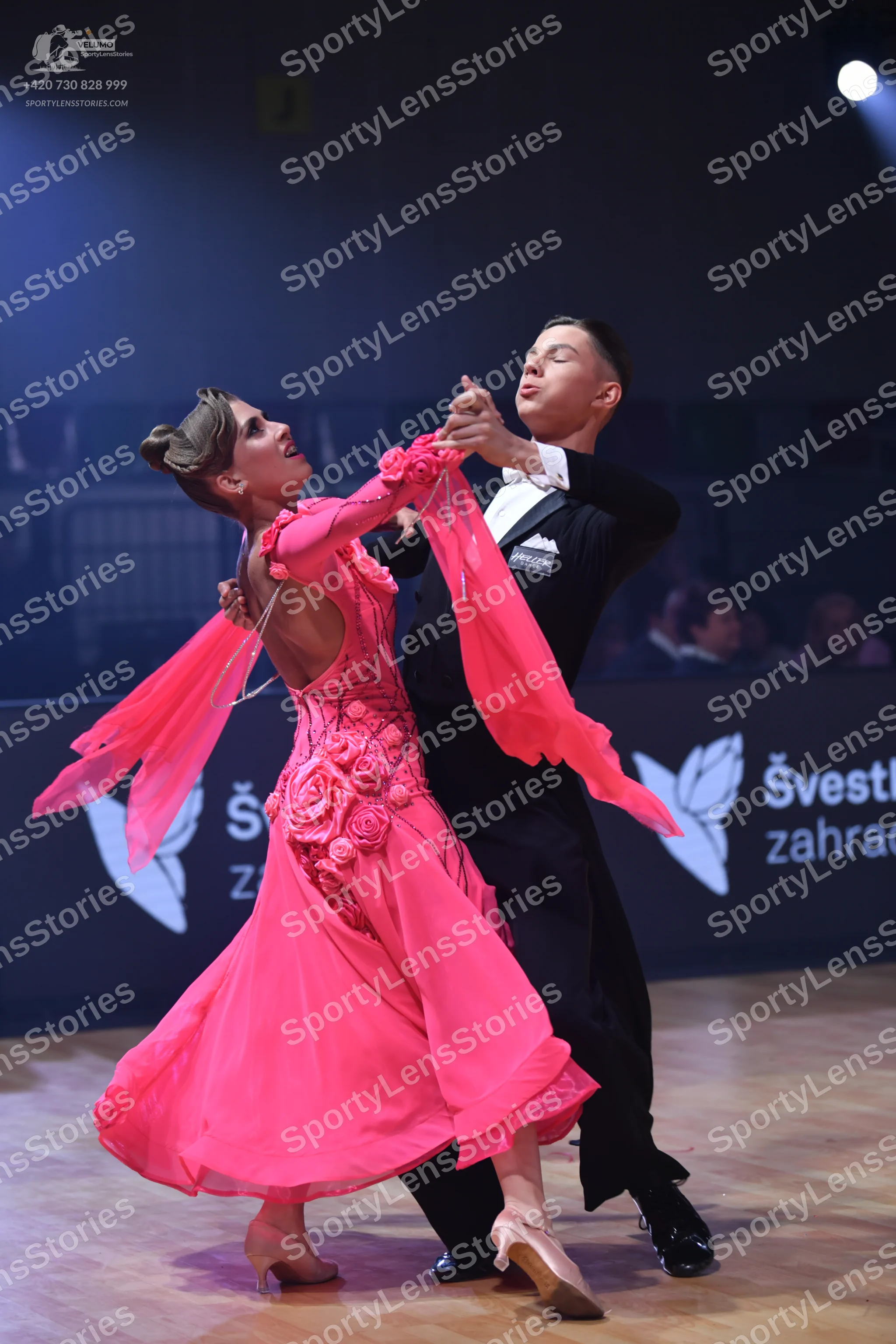 Dancesport competitor: Male dancer: black suit with a white shirt and white bowtie