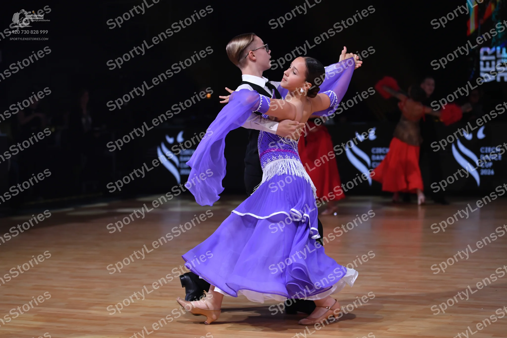 Dancesport competitor: Male dancer: white shirt with black waistcoat and black trousers