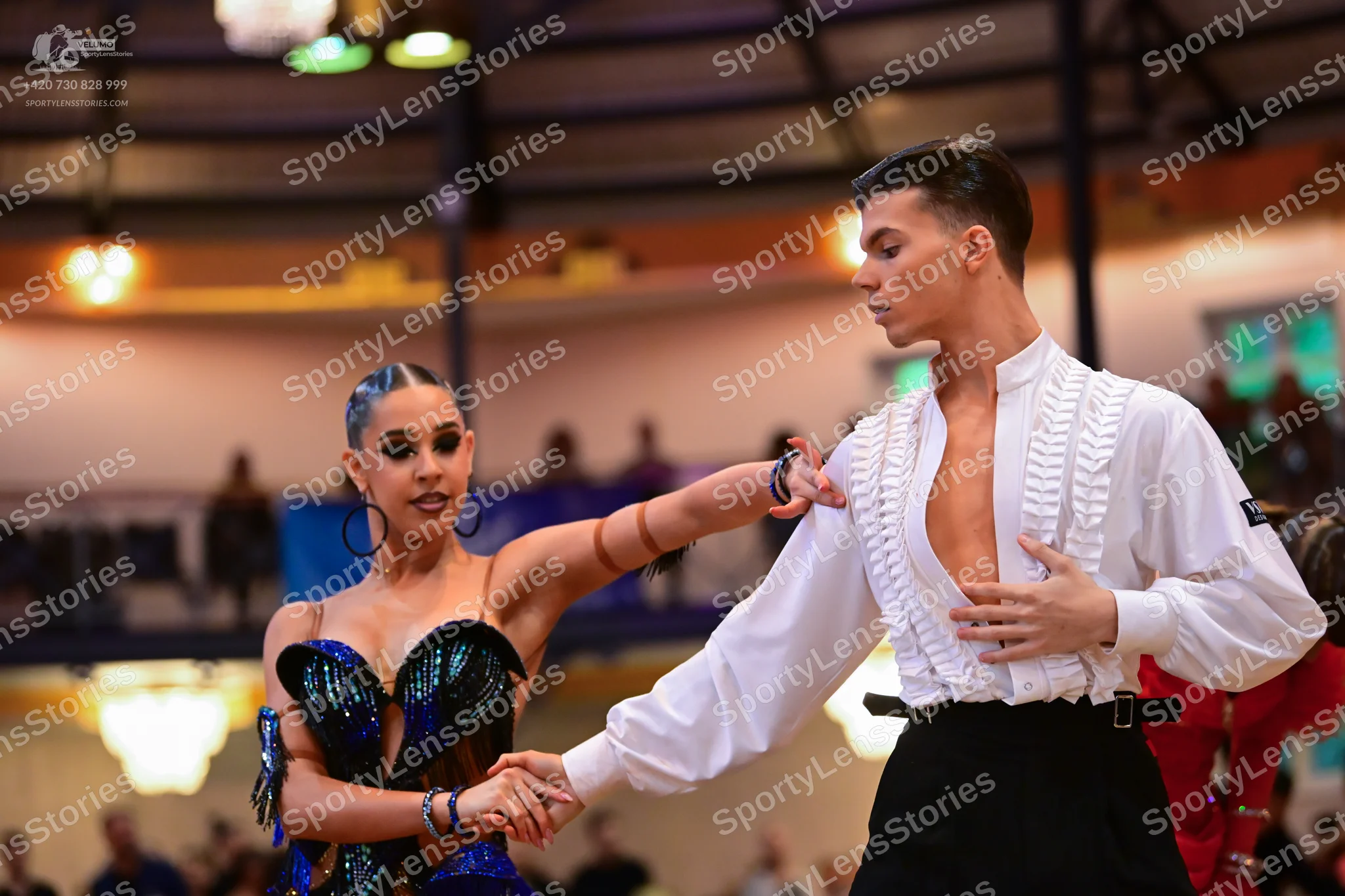 Dancesport competitor: Female dancer: navy blue sequined Latin dance bodice with dark embellishments, l