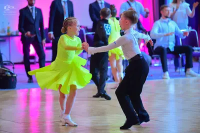 Dancesport competitor #66: Female dancer: bright neon yellow/lime green latin dress